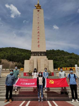 永利23411集团党支部在吴起中央红军长征胜利纪念碑前合影